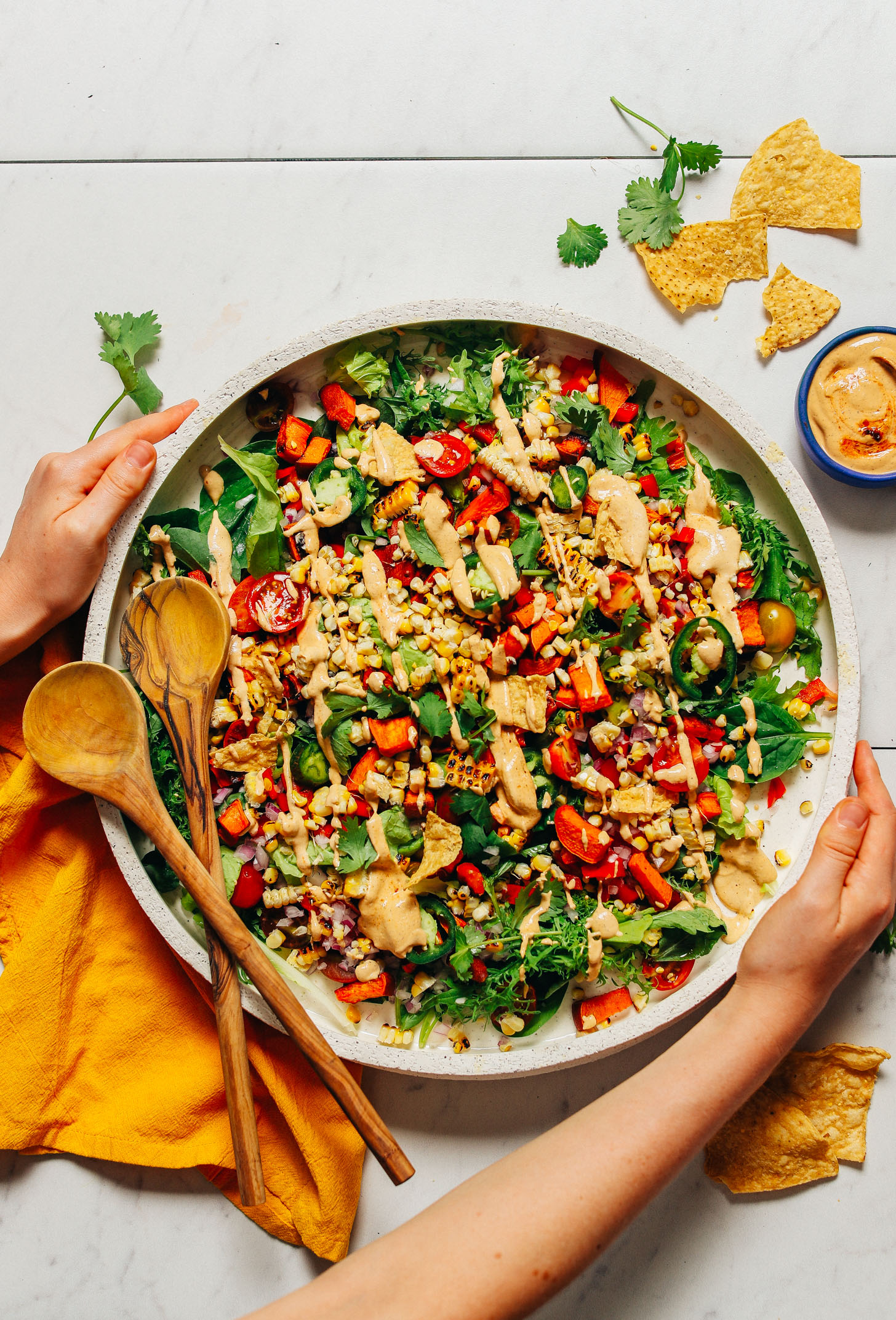 Picking up a platter of our Grilled Corn Salad drizzled with Vegan Chipotle Ranch Dressing for a refreshing summer side