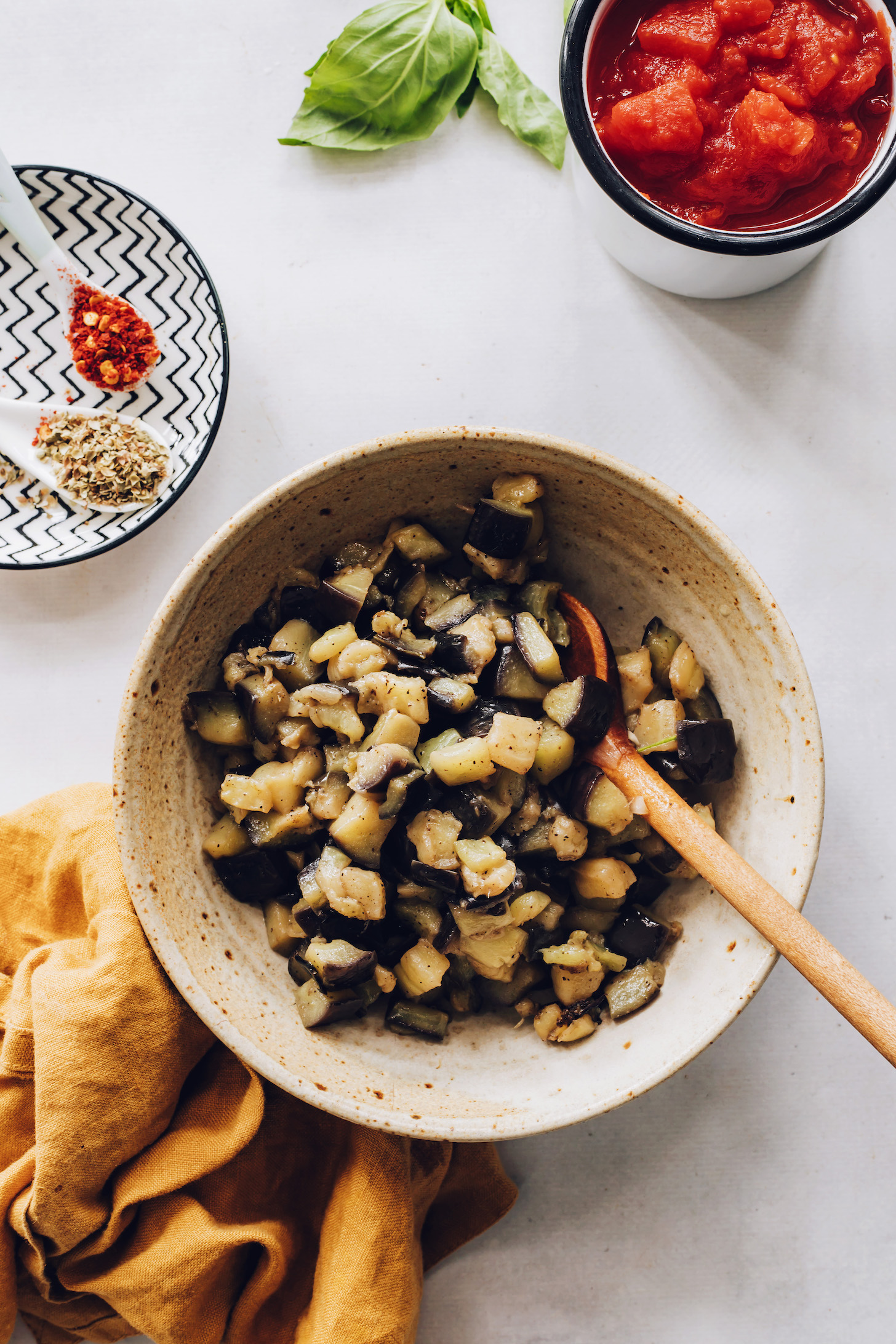 Bowl of cubed eggplant sautéed in olive oil