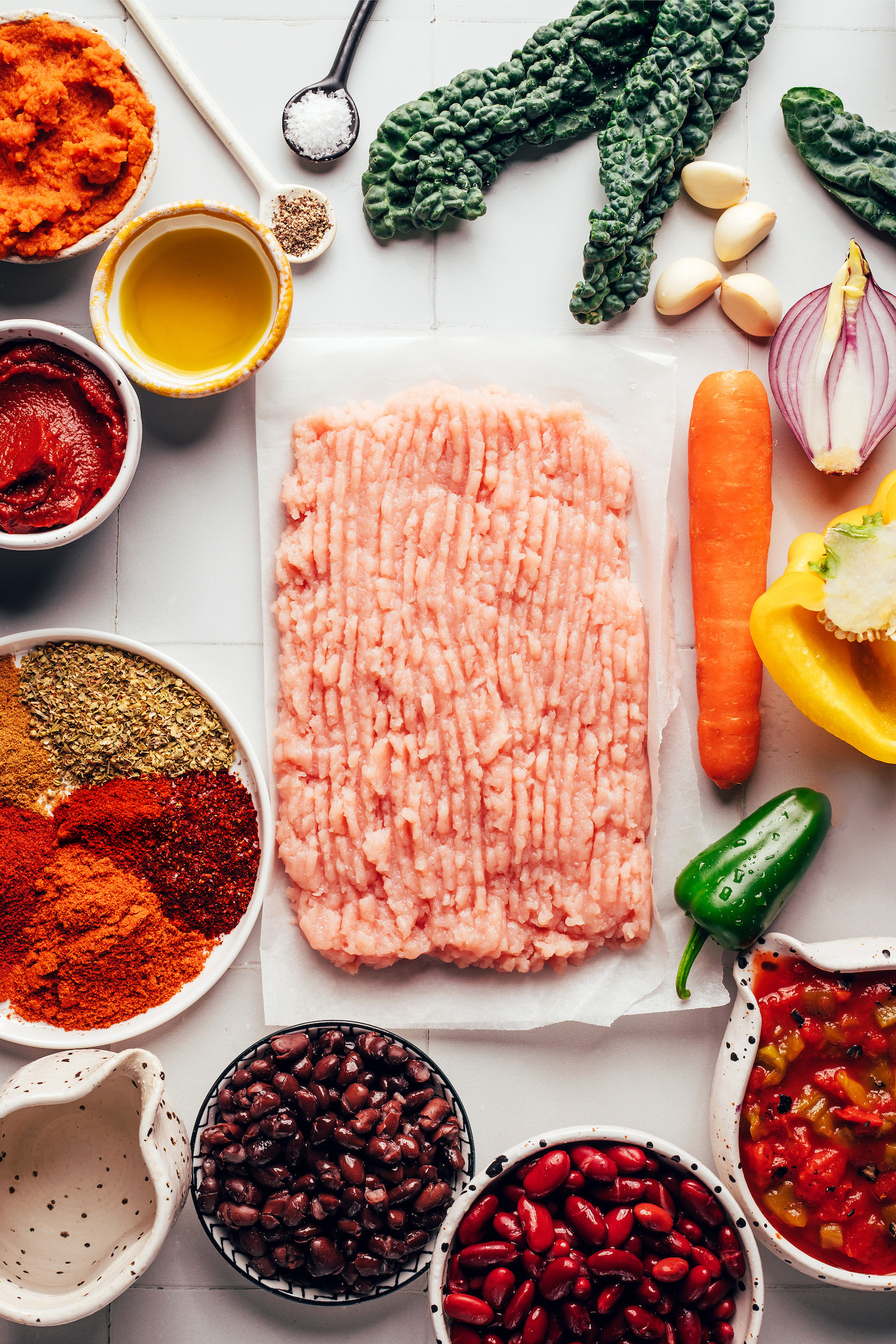 Ground turkey, carrot, bell pepper, kale, garlic, red onion, jalapeño, fire roasted diced tomatoes, kidney beans, black beans, water, spices, tomato paste, oil, salt, pepper, and pumpkin purée