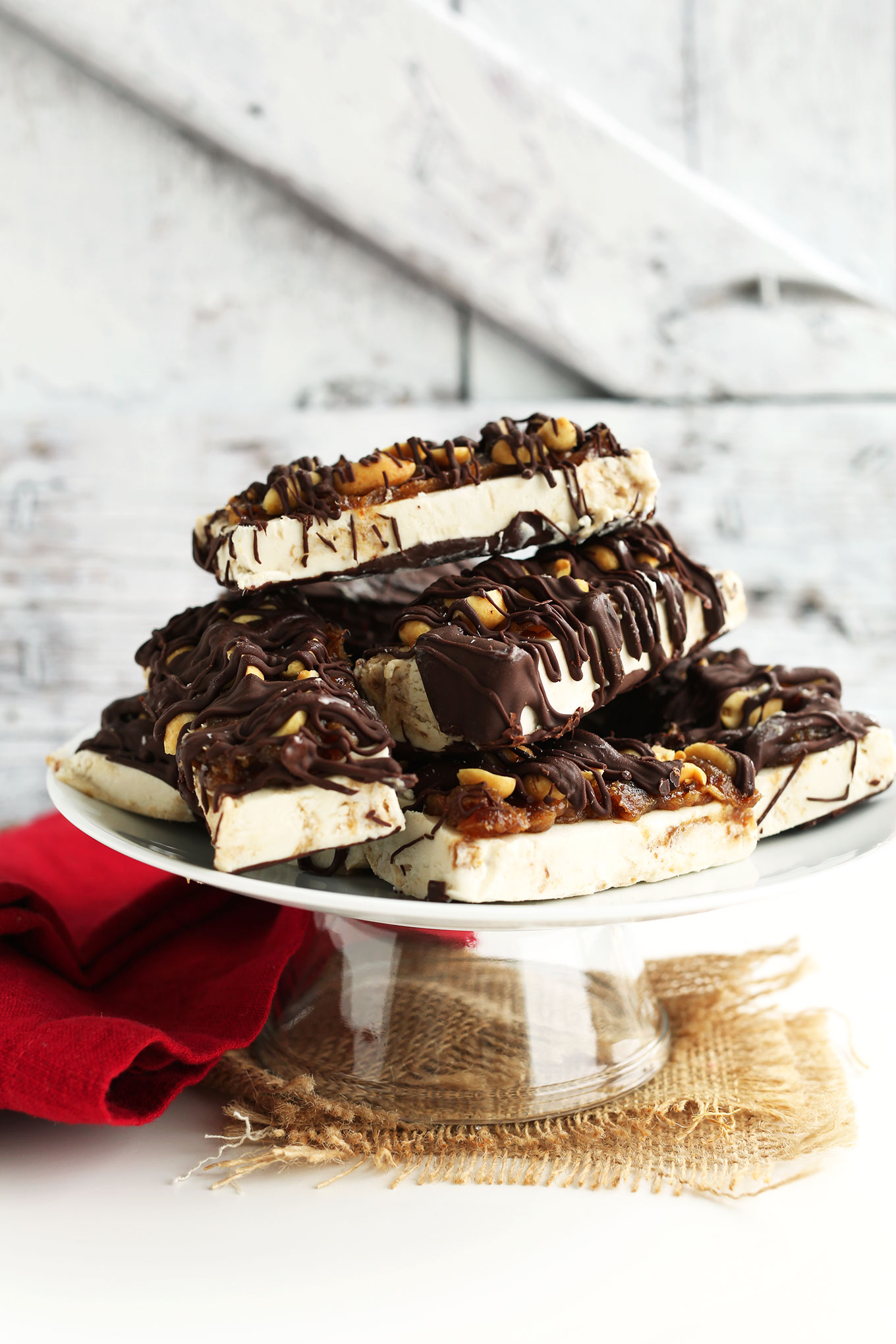 Batch of Vegan Ice Cream Snickers Bars resting on a dish for dessert