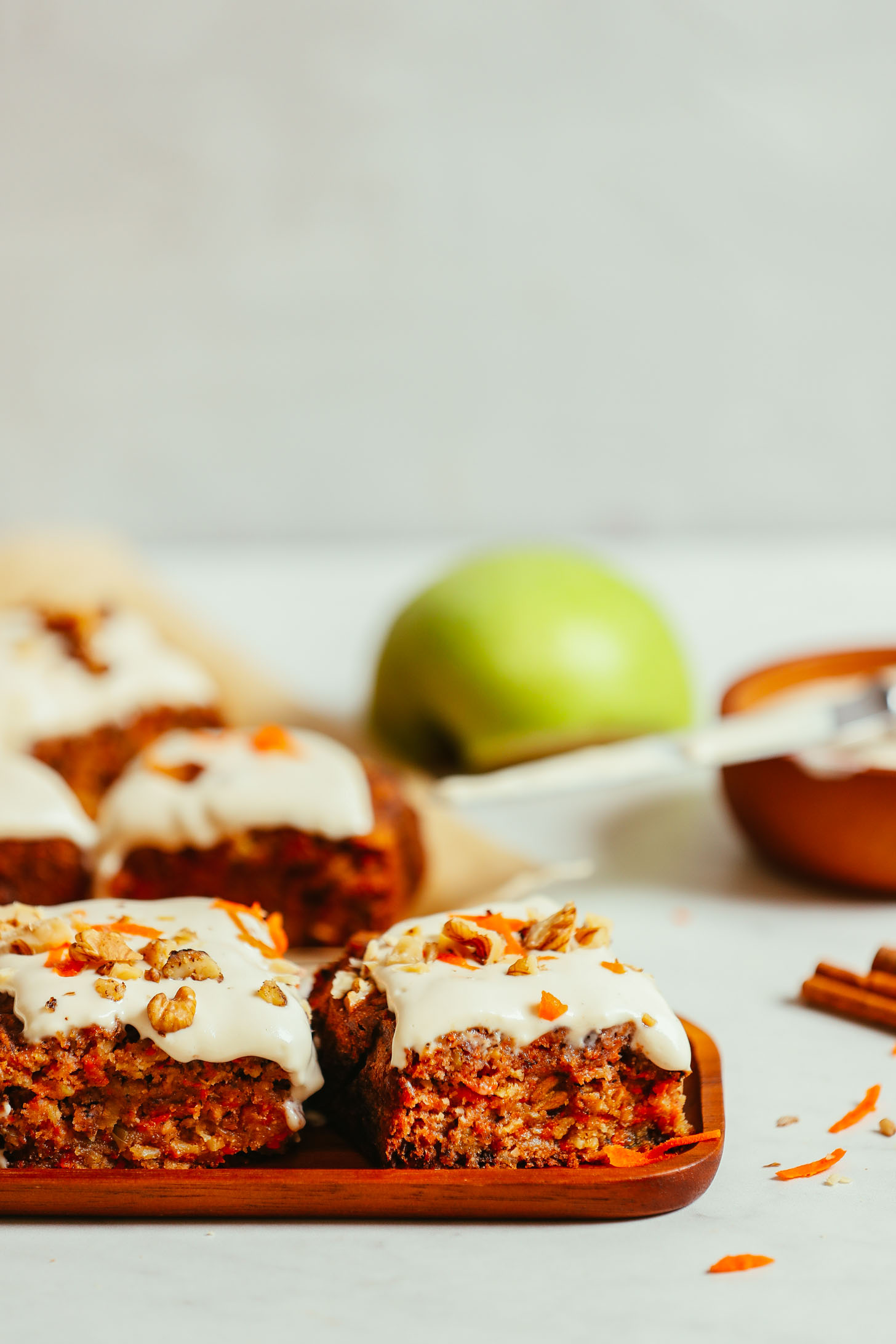 Slices of carrot apple snack cake on plates