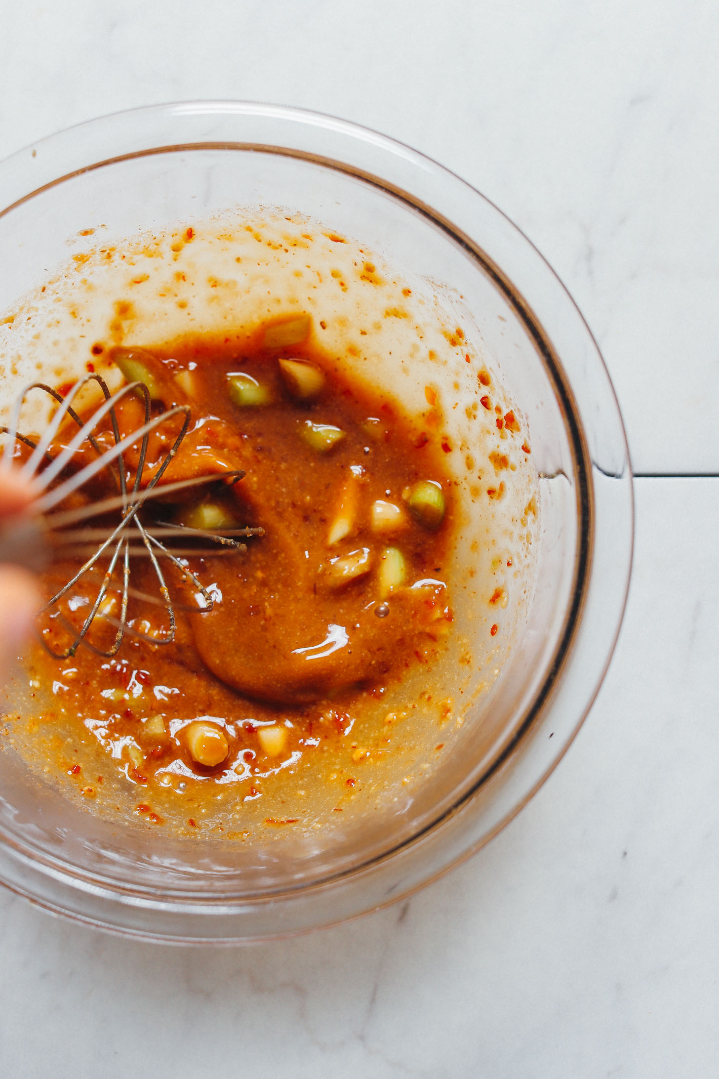 spicy-sweet sauce for vegan quinoa fried rice in mixing bowl