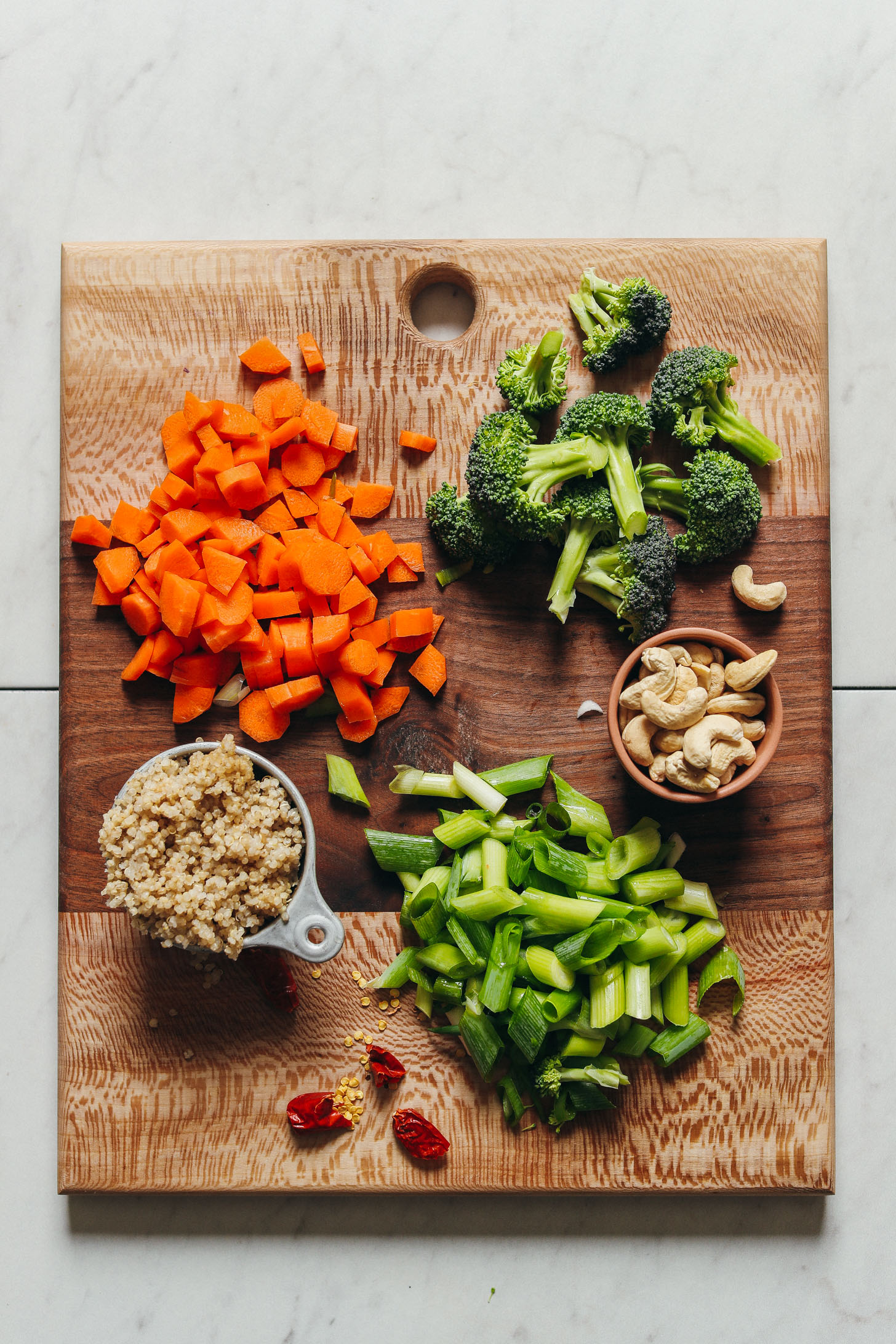 Ingredients for vegan quinoa fried rice on a cutting board