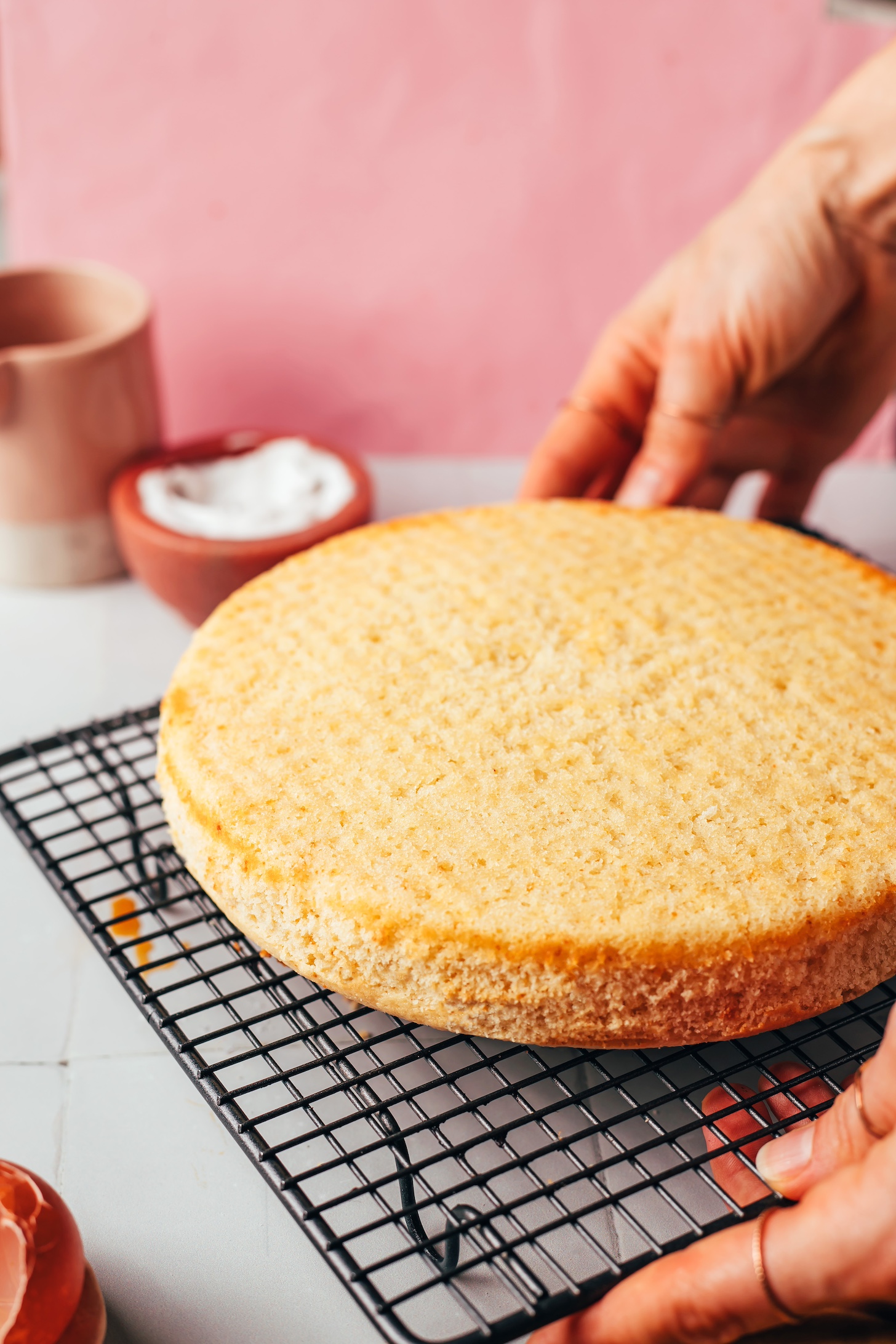 8-inch vanilla cake on a cooling rack