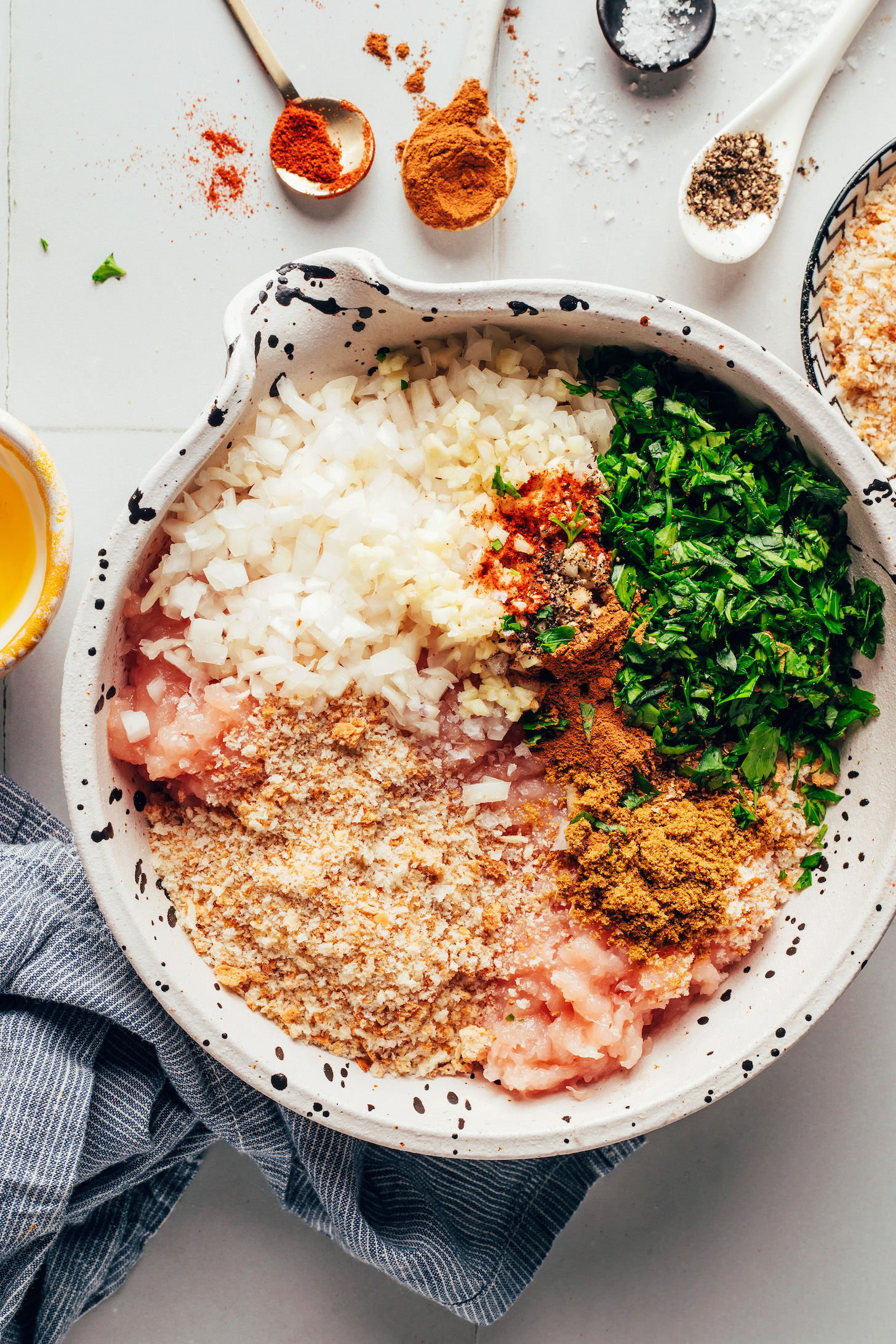 Ground chicken, bread crumbs, minced onion and garlic, spices, and chopped parley