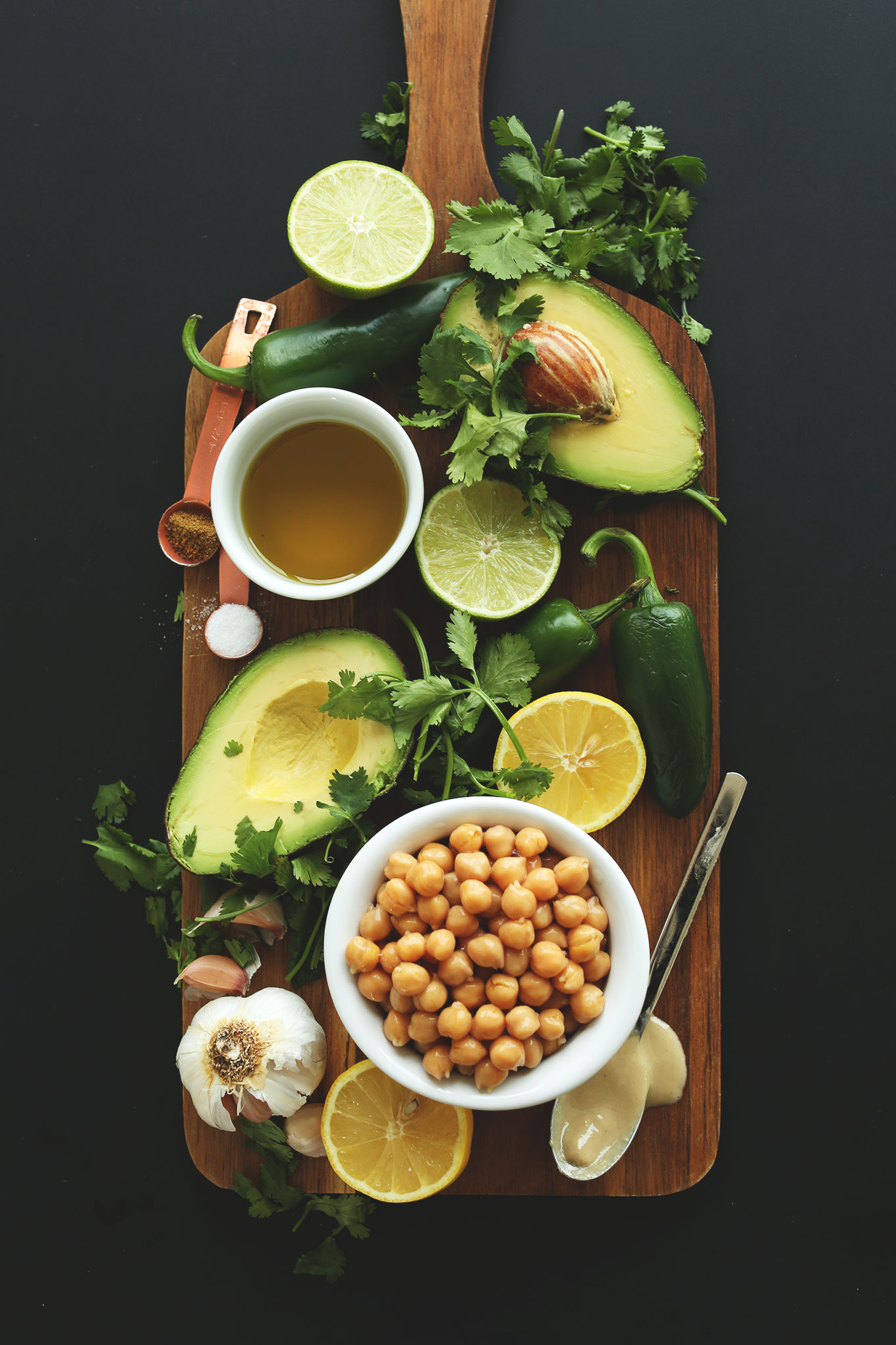 Cutting board with ingredients for making our delicious and healthy Creamy Roasted Jalapeno Hummus