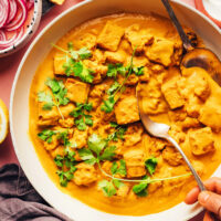 Overhead shot of a skillet of vegan tofu cauliflower korma curry