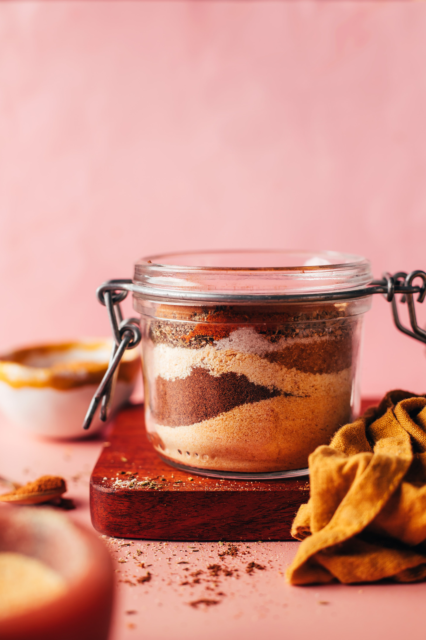 Side view of a jar with spices in layers