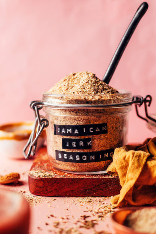 Spoon in a jar of homemade Jamaican jerk seasoning