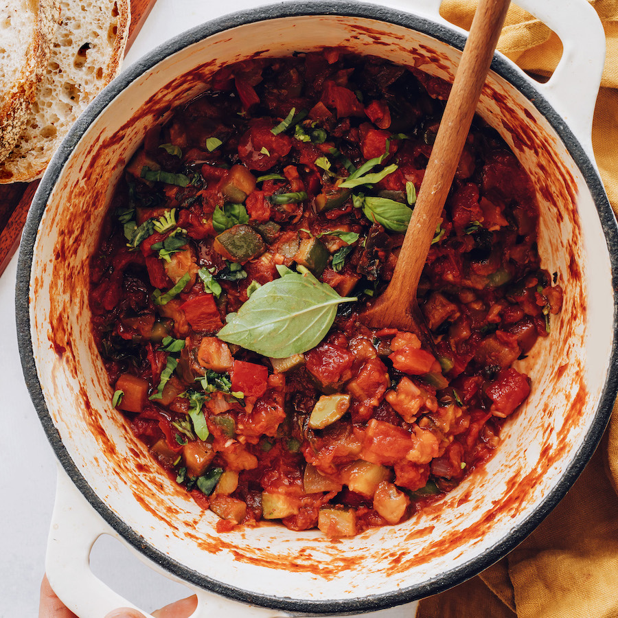 Pot of homemade ratatouille with fresh basil