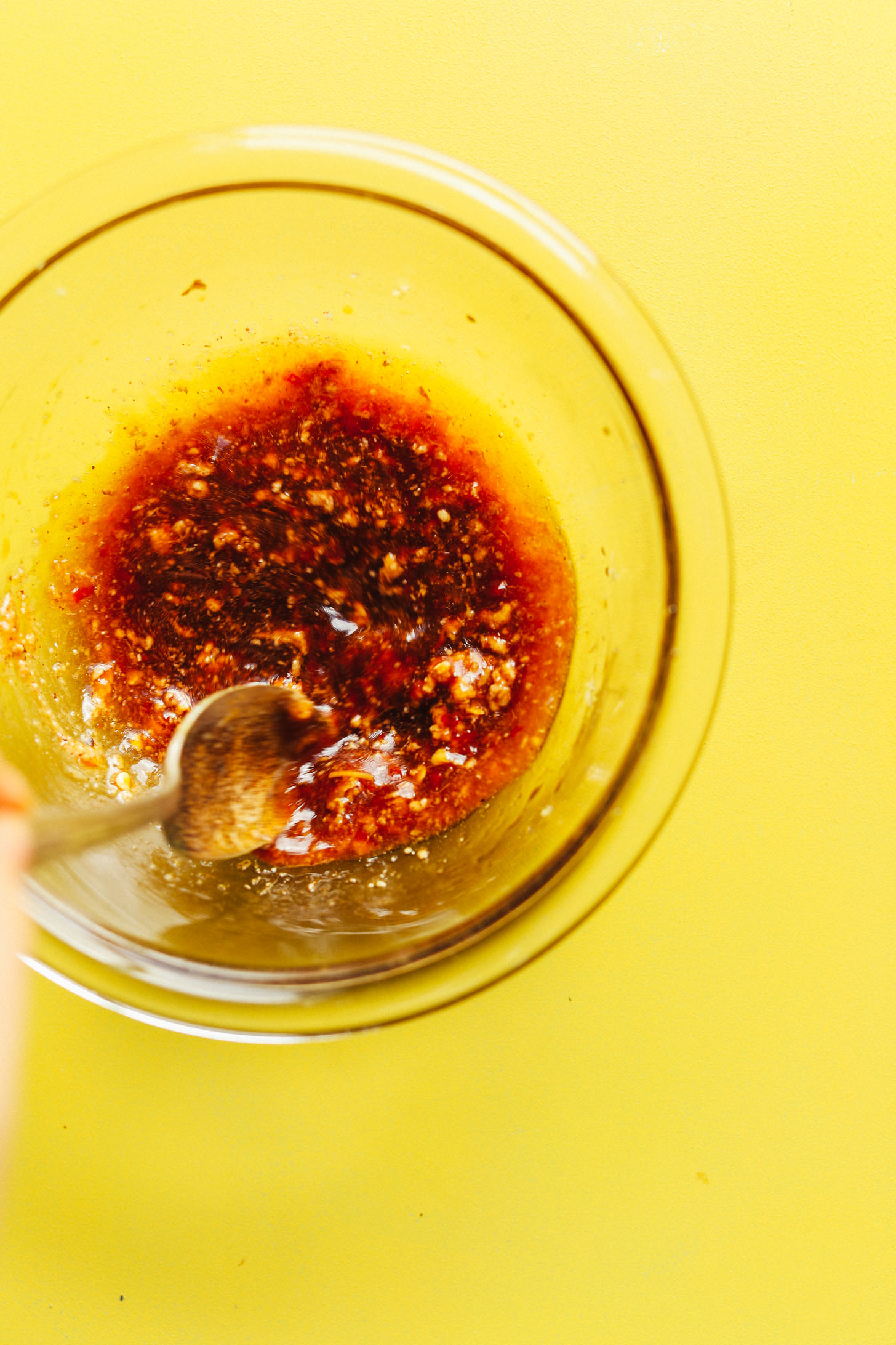 Stirring the sauce for our delicious vegan Cauliflower Rice Stir Fry with Veggies + Cashews