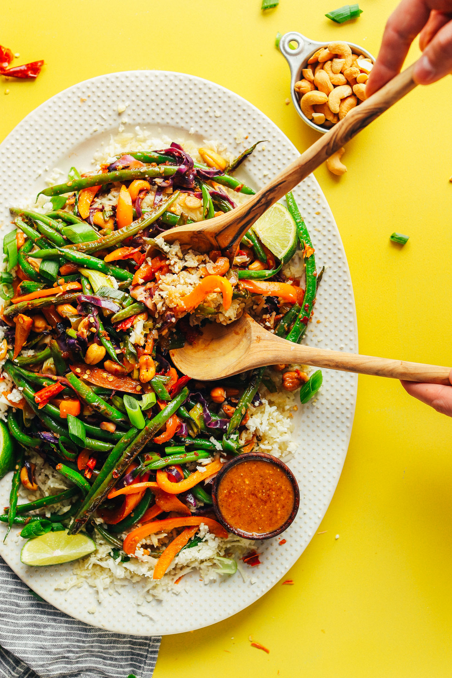 Large serving platter with Weeknight Cauliflower Rice Stir Fry with Veggies + Cashews