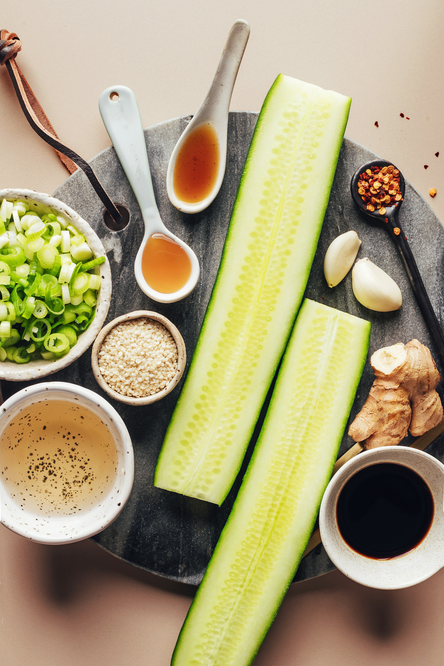 Tamari, ginger, garlic, red pepper flakes, cucumber, maple syrup, toasted sesame oil, green onion, sesame seeds, and rice vinegar