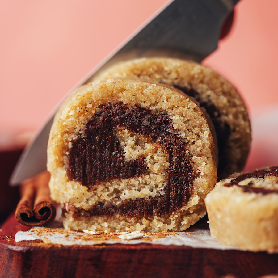 Slicing no-bake vegan and gluten-free cinnamon rolls