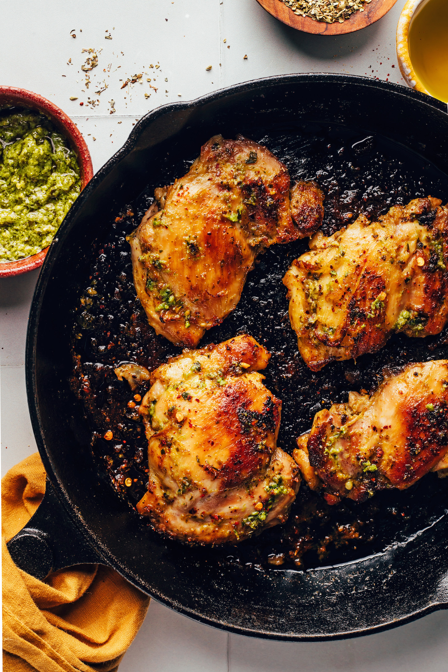 Golden brown chicken thighs in a cast iron skillet