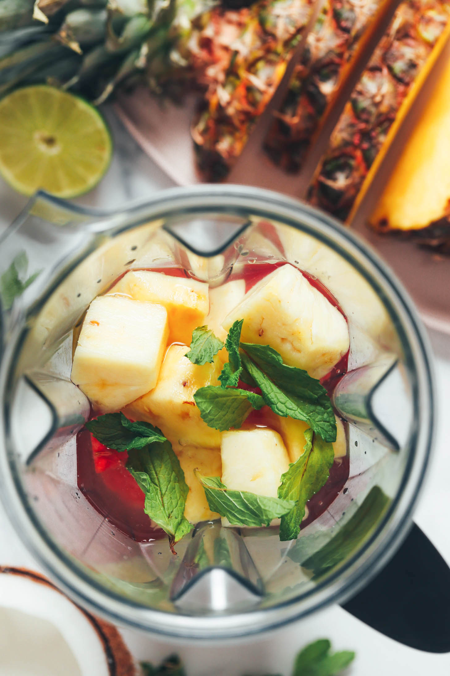 Watermelon, pineapple, coconut water, lime juice, mint, and salt in a blender