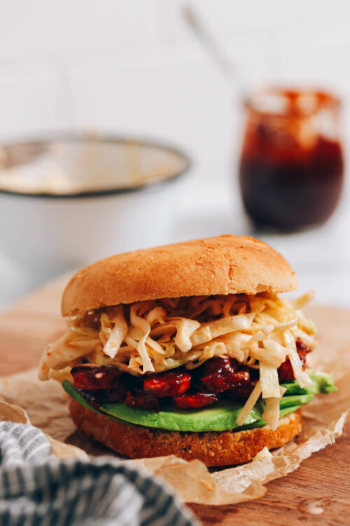 BBQ tempeh sandwich on a cutting board