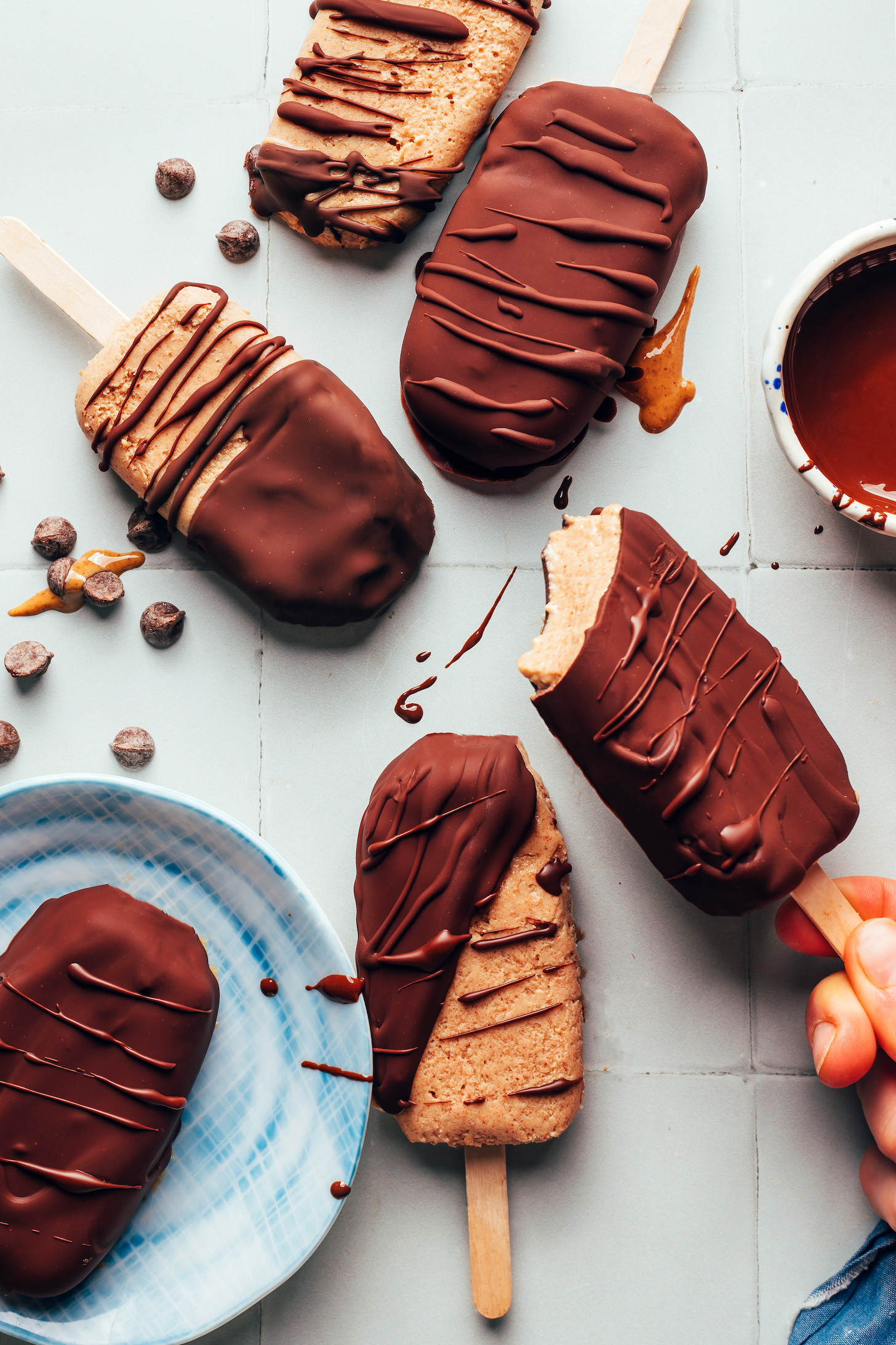 Homemade peanut butter ice cream bars with chocolate drizzles and coatings