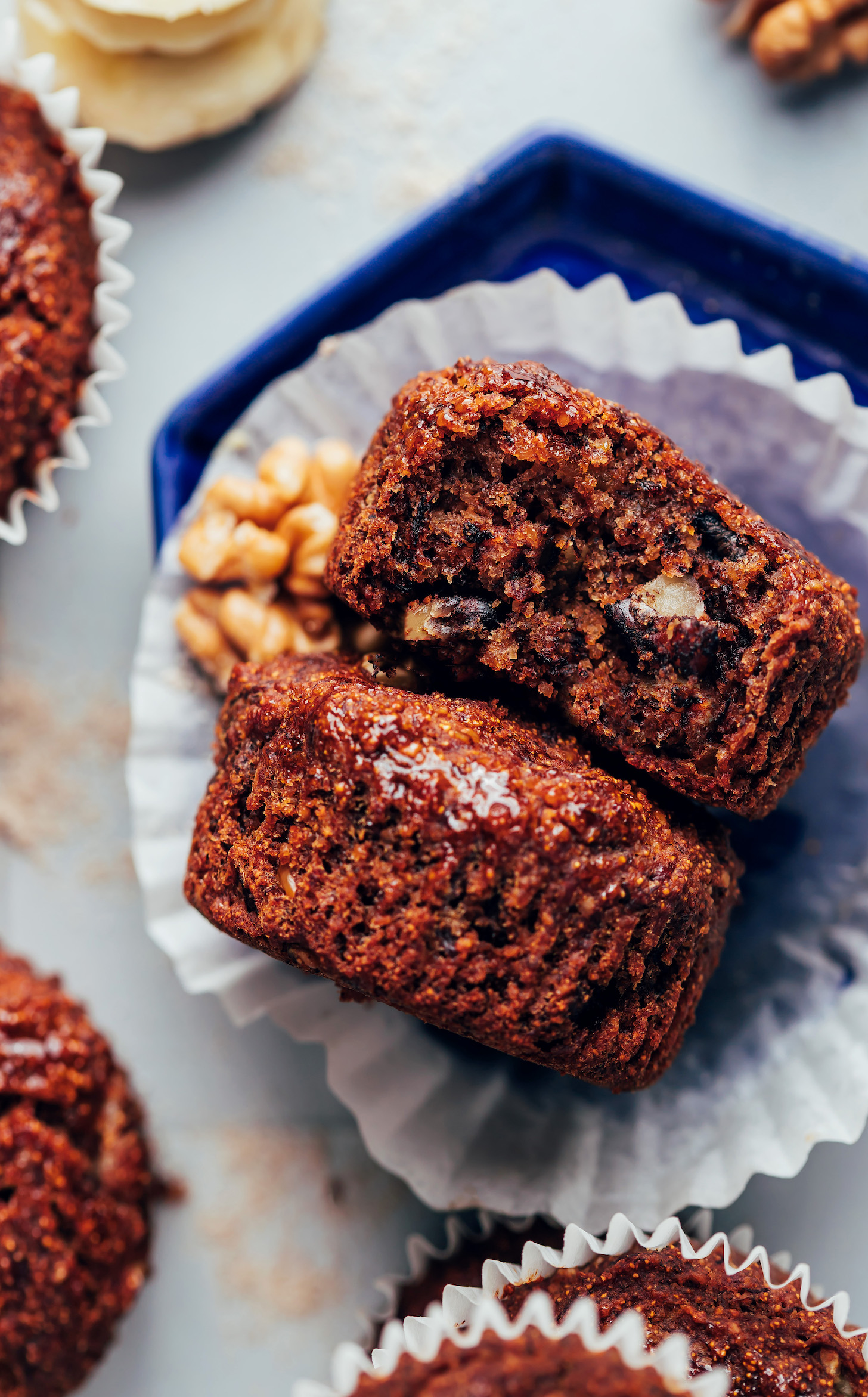 Two vegan gluten-free banana buckwheat muffins on a plate