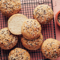 Overhead shot of a cooling rack with a batch of our vegan gluten-free hamburger bun recipe