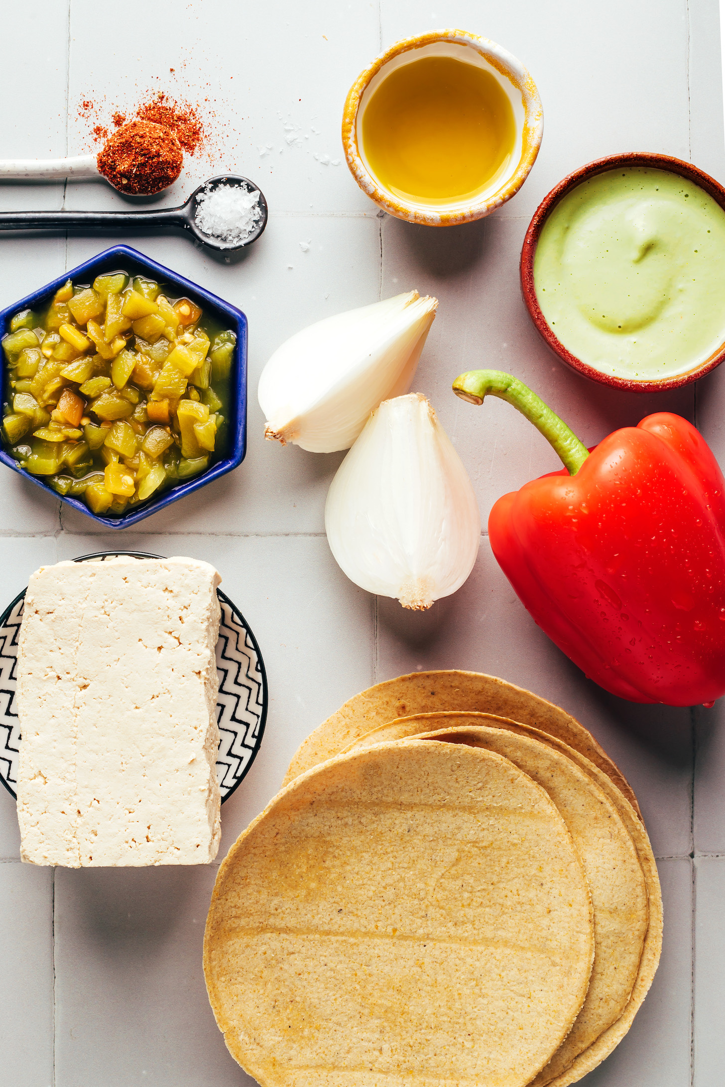 Corn tortillas, tofu, green chiles, sea salt, chili powder, olive oil, onion, bell pepper, and jalapeño cashew sauce