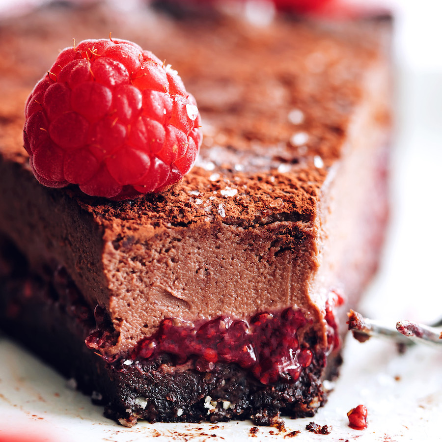 Slice of chocolate ganache tart showing the three layers