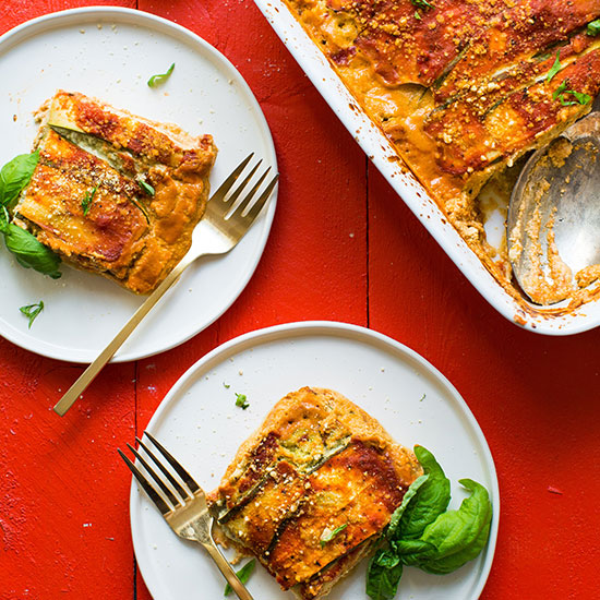 Pan and plates of Vegan Gluten-Free Zucchini Lasagna